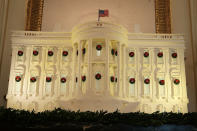 <p>The White House gingerbread house is on display in the State Dining Room at the White House during a press preview of the 2017 holiday decorations Nov. 27, 2017 in Washington, D.C. (Photo: Saul Loeb/AFP/Getty Images) </p>
