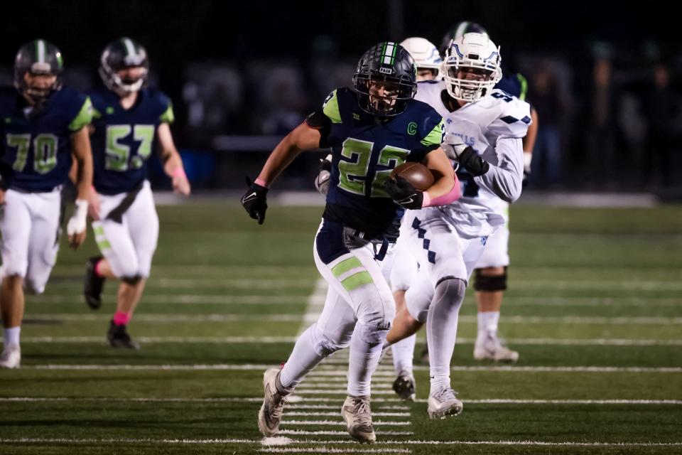 Timpanogos’ Easton Bretzing runs the ball in a high school football game against Salem Hills in Orem on Friday, Oct. 6, 2023. | Spenser Heaps, Deseret News