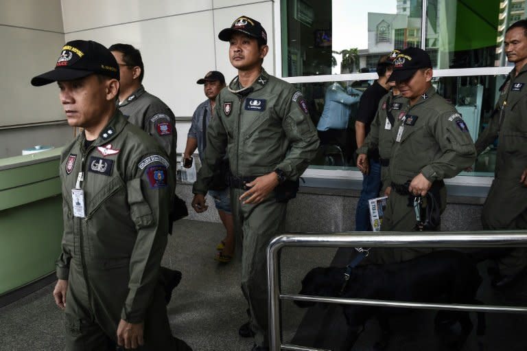 A Thai police forensics team leaves a Bangkok hospital that was struck by a small bomb on May 22, 2017