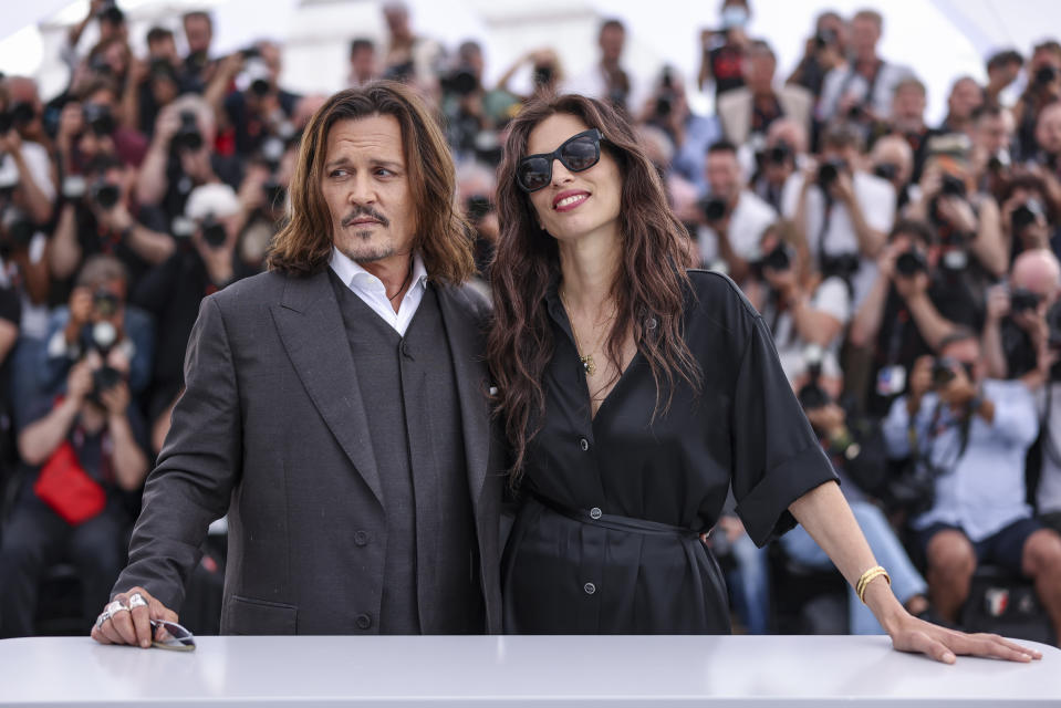 Johnny Depp, left, and director Maiwenn pose for photographers at the photo call for the film 'Jeanne du Barry' at the 76th international film festival, Cannes, southern France, Wednesday, May 17, 2023. (Photo by Vianney Le Caer/Invision/AP)