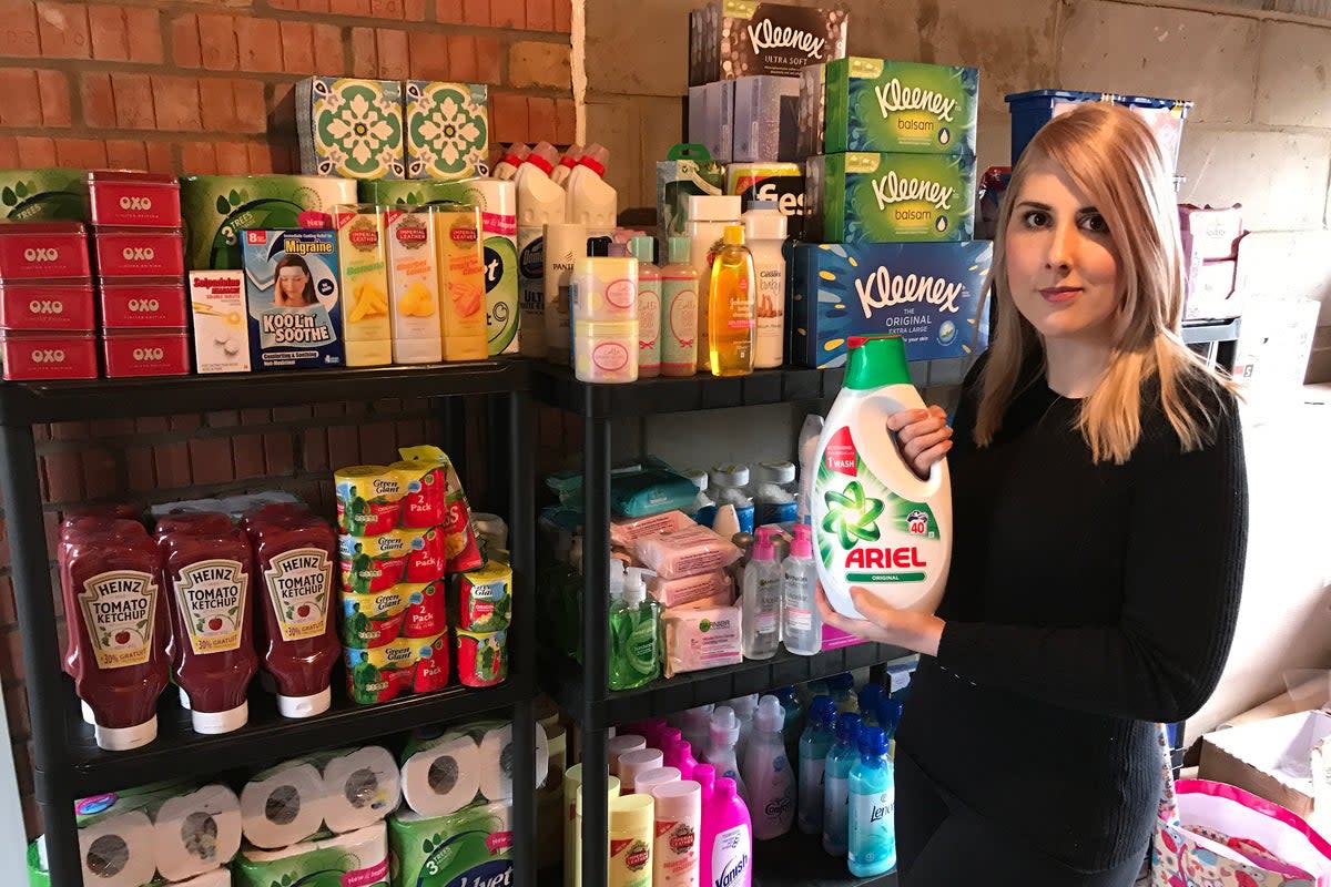 Holly Jay-Smith, whose Facebook group ‘Extreme Coupons and Bargains’ has 2.4 million members, pictured with her stockpile of non-perishables  (Supplied by Holly Jay-Smith)