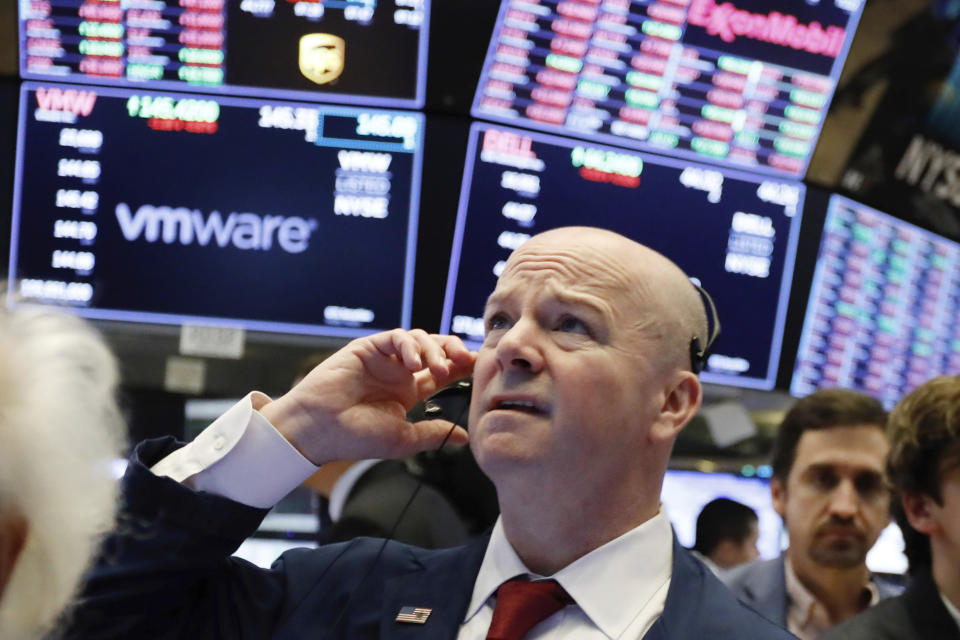 Trader Patrick Casey works on the floor of the New York Stock Exchange, Monday, Jan. 14, 2019. Stocks are opening lower on Wall Street after China reported a surprise drop in exports to the U.S. last month. (AP Photo/Richard Drew)