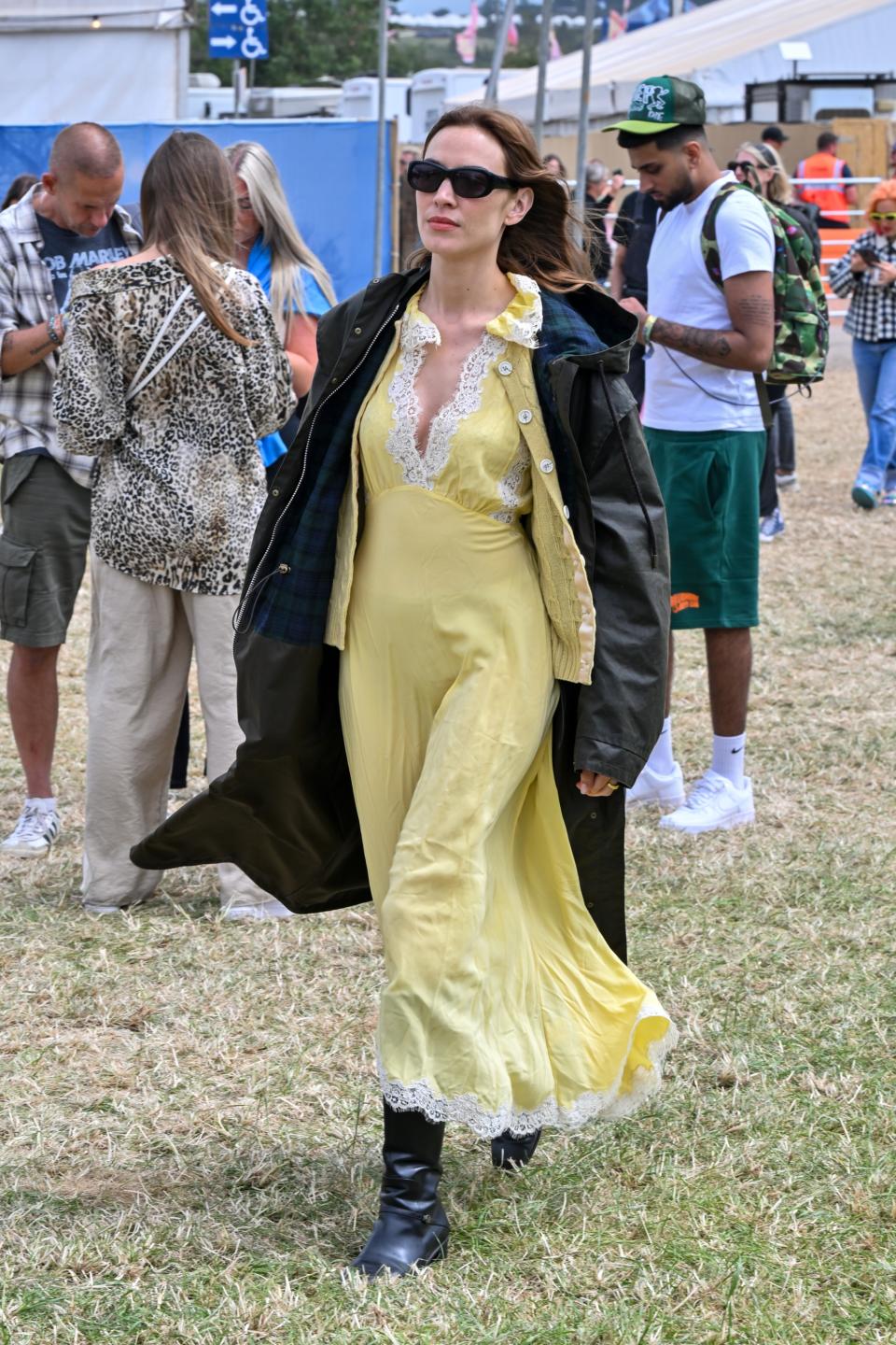 GLASTONBURY, ENGLAND - JUNE 28: Alexa Chung is spotted at Glastonbury festival teasing her upcoming AW24 Barbour collection on June 28, 2024 in Glastonbury, England. (Photo by Jed Cullen/Dave Benett/Getty Images)