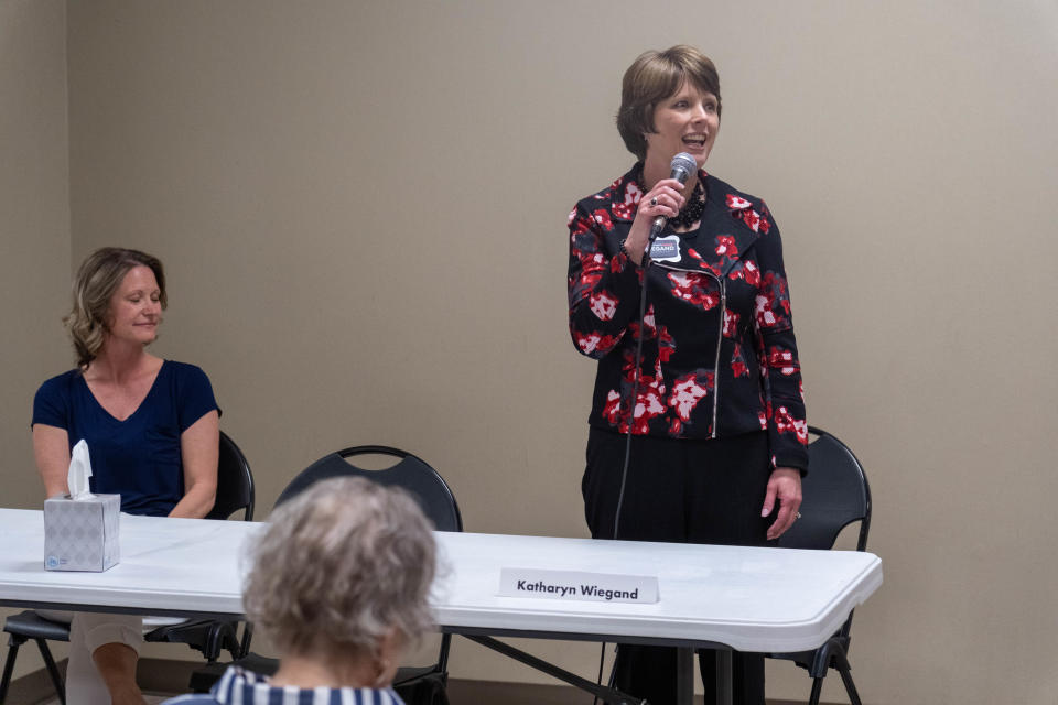 Katharyn Wiegand, a candidate for reelection to the Canyon Independent School Board, addresses the audience with her opponent Jodi Davis looking on at the LWV candidate forum in Canyon.