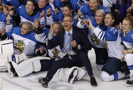 Ice Hockey - Pyeongchang 2018 Winter Olympics - Women's Bronze Medal Match - Finland v Olympic Athletes from Russia - Kwandong Hockey Centre, Gangneung, South Korea - February 21, 2018 - Finland coach Pasi Mustonen celebrates with players after the match. REUTERS/Kim Kyung-Hoon