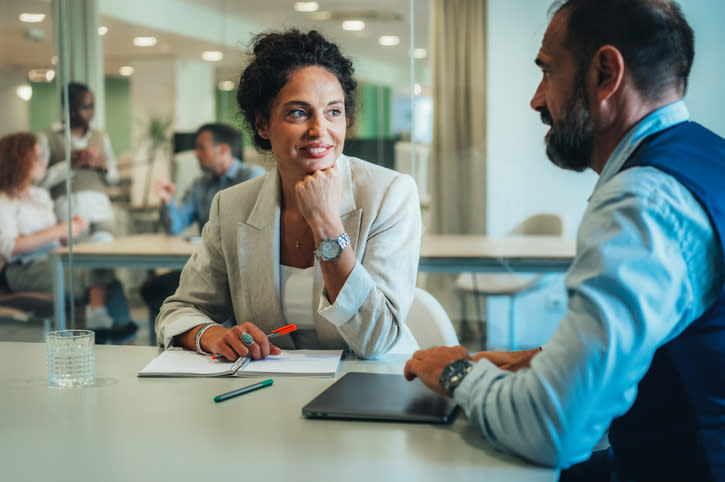 A client discussing a financial plan with a financial advisor.