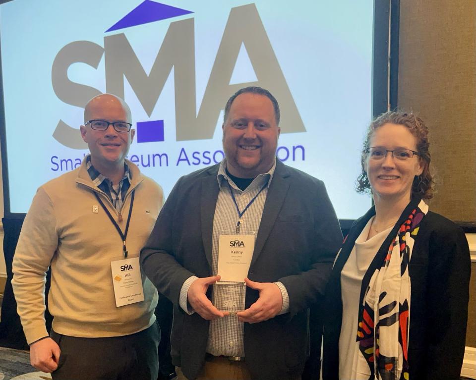 Small Museum Association President Kristen Butler (right) and Vice President William Roulett (left) present CRF Curator Kenny Libben with the Hunter-Burley Award.