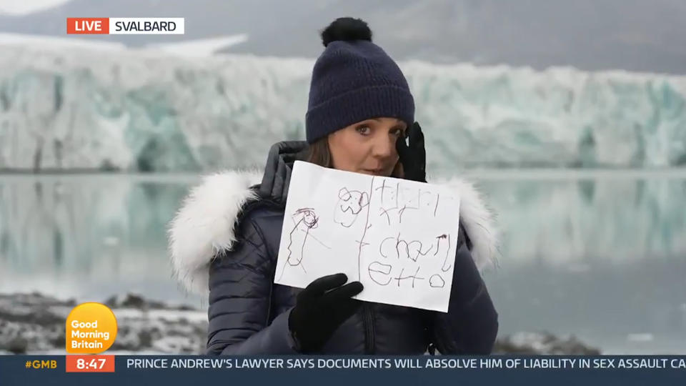 Laura Tobin presented 'GMB' from Svalbard in 2021, holding up a picture her daughter drew of a polar bear. (ITV)