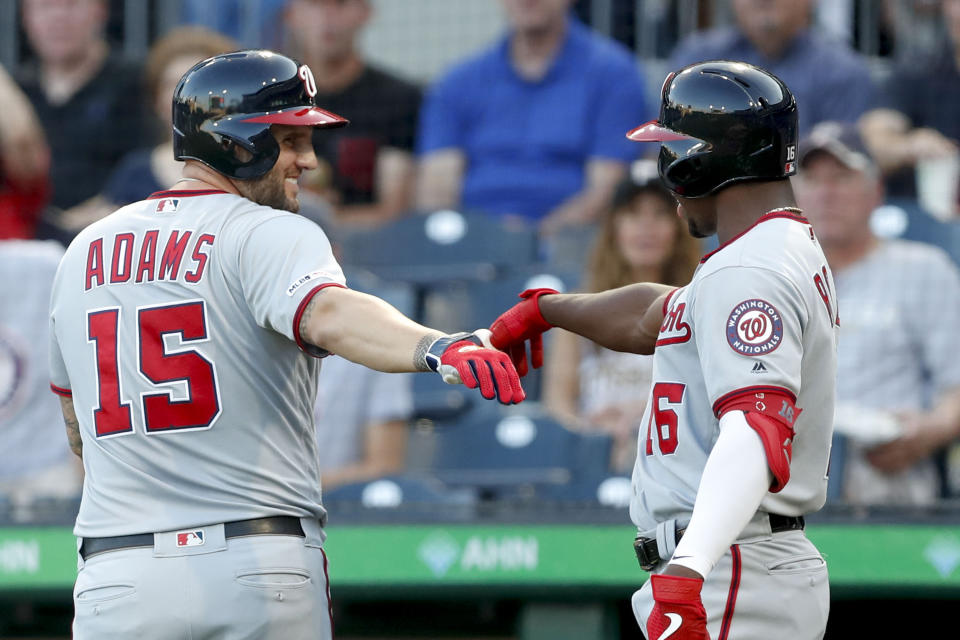 Washington Nationals' Matt Adams (15) is greeted by on-deck batter Victor Robles after hitting a two-run home run against the Pittsburgh Pirates in the first inning of a baseball game, Monday, Aug. 19, 2019, in Pittsburgh. (AP Photo/Keith Srakocic)