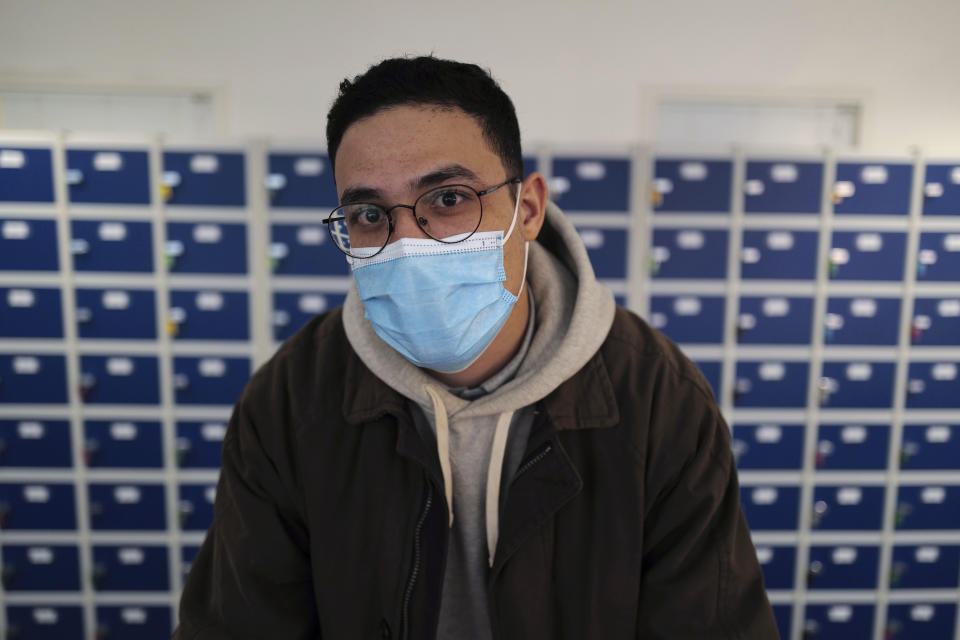 Zinedine Gaid, teacher of economy sciences and philosophy poses at the MHS, Meo High School private college, in Paris Tuesday, Feb. 9, 2021. More than three dozen police officers descended on the small private school, blocked students inside their classrooms, took photos everywhere, even inside the refrigerator, and grilled the school director in her office. Such operations illustrate French efforts to fight extremism as lawmakers prepare to vote on a bill aimed at snuffing it out. (AP Photo/Francois Mori)