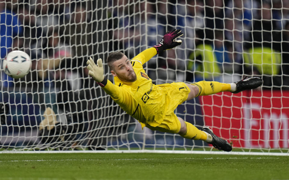 FILE - Manchester United's goalkeeper David de Gea attempts to save a penalty in a shootout 3during the English FA Cup semifinal between Manchester United and Brighton and Hove Albion at Wembley Stadium in London, Sunday, April 23, 2023. Veteran goalkeeper David de Gea has announced he is leaving Manchester United as a free agent after 12 seasons at Old Trafford. The 32-year-old's contract with United expired at the end of June, with no new deal agreed despite talks that took place throughout the season. (AP Photo/Alastair Grant, File)