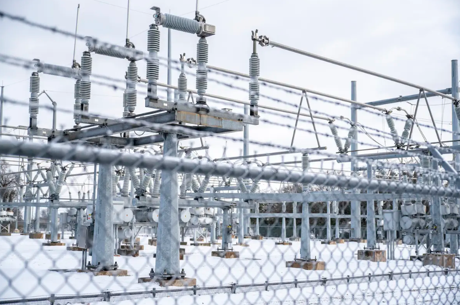 Snow surrounds an Austin Energy station in Austin on Feb. 18, 2021 during a powerful winter storm that left millions of Texans without power or heat for days. The state's power grid operator tried to get additional power online to prepare for this winter before abandoning the effort after a poor response.