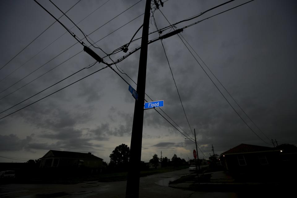 A street sign shows Flood Street in the Lower Ninth Ward neighborhood in an area affected by Hurricane Katrina in New Orleans, Louisiana, August 18, 2015. (REUTERS/Carlos Barria)