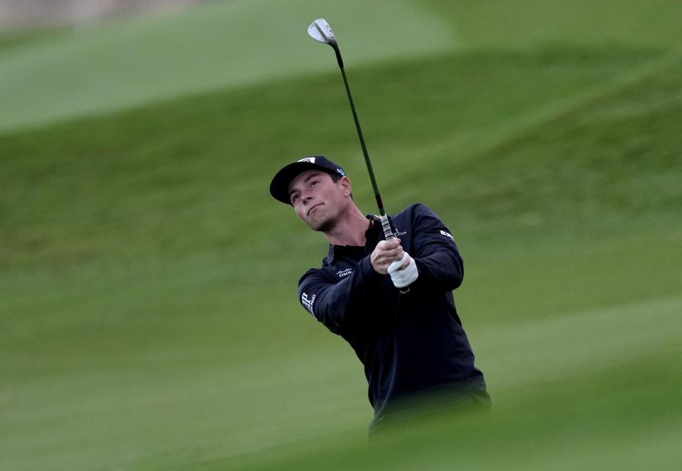 Viktor Hovland of Norway follows his ball on the 10th hole during the second round of the Abu Dhabi Championship golf tournament at the Yas Links Golf Course, in Abu Dhabi, United Arab Emirates, Friday, Jan. 21, 2022. (AP Photo/Kamran Jebreili)