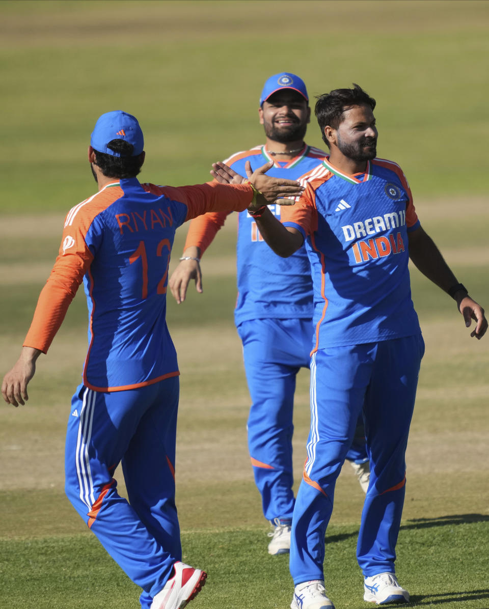 Indian players celebrate a wicket during the T20 cricket match between Zimbabwe and India at the Harare Sports club, in Harare, Sunday, July 14, 2024. (AP Photo/Tsvangirayi Mukwazhi)