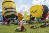 <p>Hot air Balloons are being tethered as balloonists prepare to launch at the Bristol international balloon fiesta held on August 10, 2017 in Avon, England. (Photo: Amer Ghazzal/Barcroft Images) </p>