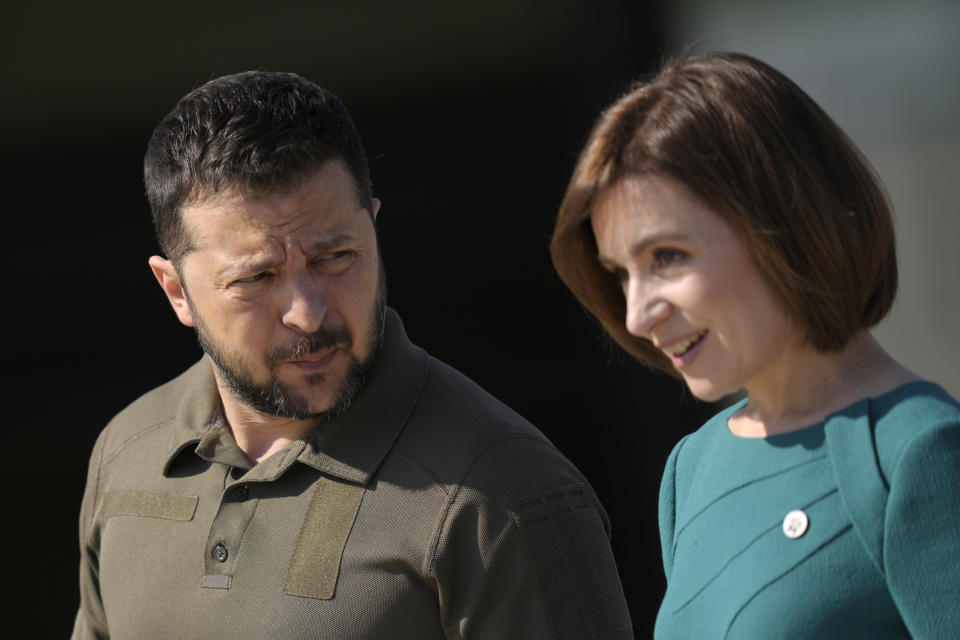 Moldova's President Maia Sandu, right, speaks with Ukraine's President Volodymyr Zelenskyy during arrivals for the European Political Community Summit at the Mimi Castle in Bulboaca, Moldova, Thursday, June 1, 2023. Leaders are meeting in Moldova Thursday for a summit aiming to show a united front in the face of Russia's war in Ukraine and underscore support for the Eastern European country's ambitions to draw closer to the West and keep Moscow at bay. (AP Photo/Vadim Ghirda)