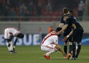 Football Soccer - Olympiakos v Arsenal - Champions League Group stage - Group F, Athens, Greece - 09/12/15 Arsenal's Kieran Gibbs comforts Olympiakos' Dimitris Siovas at the end of the match REUTERS/Alkis Konstantinidis