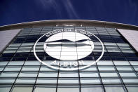 FILE - This Jan, 18, 2020 file photo shows a general view of the club crest on the side of the AMEX Stadium, home to Brighton & Hove Albion, Brighton, England. A Brighton player tested positive for the coronavirus as Premier League clubs prepare for talks on Monday, May 11 about how to resume the competition during the pandemic. The southern England club told The Associated Press there is no need for other members of the squad or coaches to self-isolate because players have only worked in isolation when at the training base. (Gareth Fuller/PA via AP, file)