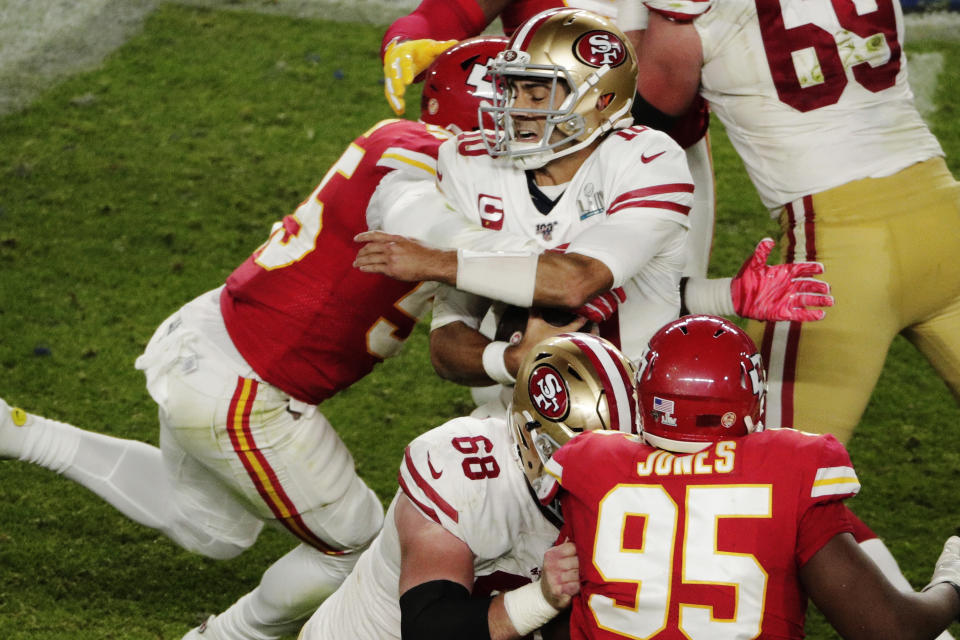 Kansas City Chiefs' Frank Clark (55) sacks San Francisco 49ers quarterback Jimmy Garoppolo (10), during the second half of the NFL Super Bowl 54 football game Sunday, Feb. 2, 2020, in Miami Gardens, Fla. (AP Photo/Charlie Riedel)