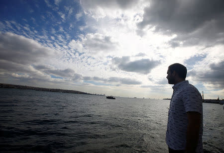 Naz Osmanoglu, a British comedian and member of Turkey's former ruling family, looks at the Bosphorus, at the entrance of the Ottoman-era Dolmabahce Palace in Istanbul, Turkey, October 19, 2016. REUTERS/Osman Orsal