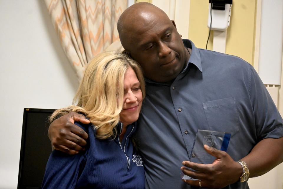 Exeter resident Jeff Neil, seen with his wife, Libby, received a Citizen Award Friday, March 24, 2023, from the Exeter Police Department in recognition of his actions aboard a recent United Airlines flight.