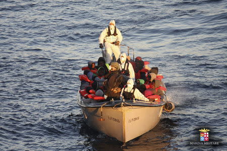 Migrants are rescued by the Italian Navy in the Mediterranean Sea, in this picture released on January 28, 2016 by Italian Navy.REUTERS/Italian Navy/Handout via Reuters