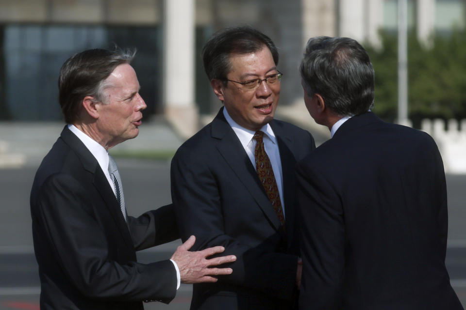 U.S. Secretary of State Antony Blinken, right, is welcomed by Yang Tao, center, Director General of the Department of North American and Oceanian Affairs of the Foreign Ministry, and U.S. Ambassador to China Nicholas Burns, left, as he arrives in Beijing, China, Sunday, June 18, 2023. (Leah Millis/Pool Photo via AP)