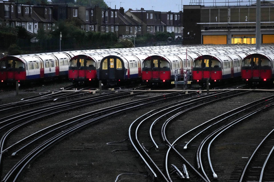 Piccadilly line trains sit in their depot as members of the Rail, Maritime and Transport union (RMT) continue nationwide strikes in a bitter dispute over pay, jobs and conditions in London, Friday, Aug. 19, 2022.(AP Photo/Frank Augstein)