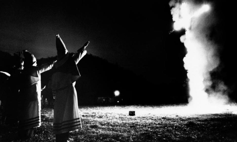 Robed and hooded members of the Ku Klux Klan burned a cross in Kanawha County, 15 February 1975.