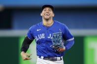 Toronto Blue Jays center fielder George Springer heads to the dugout during a break in baseball game action against the New York Yankees in Toronto, Monday, Sept. 26, 2022. (Cole Burston/The Canadian Press via AP)