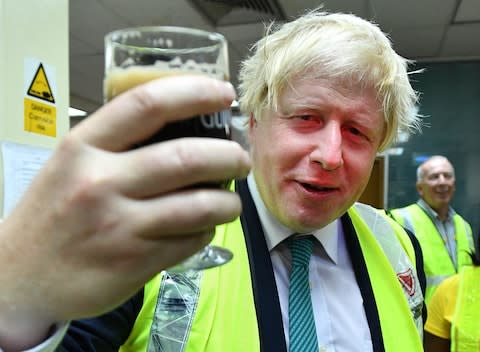 Foreign Secretary Boris Johnson samples a Guinness at the Diageo Factory in Lagos, Nigeria - Credit: Andrew Parsons / i-Images