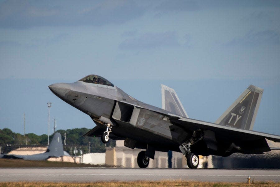 An F-22 Raptor fighter jet displaying the "TY" tail code indicating that it is from Tyndall Air Force Base,  touches down at Eglin Air Force Base. Thirty-three F-22s from Tyndall's 325th Fighter Wing, which has been working out of Eglin AFB since Hurricane Michael devastated Tyndall AFB, are scheduled to be retired under the current U.S. defense budget proposal for the upcoming 2023 fiscal year.