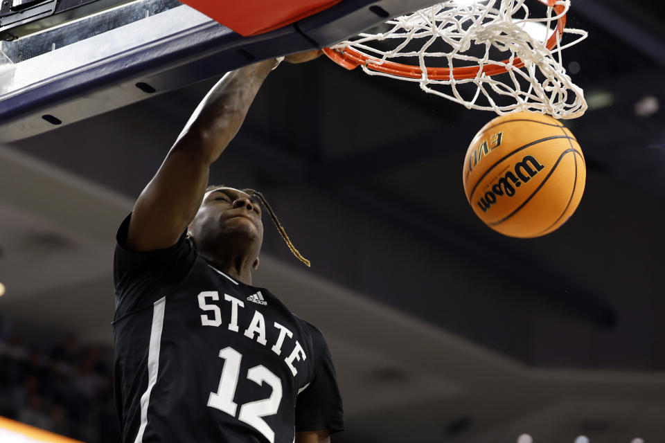 Mississippi State forward KeShawn Murphy slam dunks the ball during the first half of an NCAA college basketball game against Auburn, Saturday, March 2, 2024, in Auburn, Ala. (AP Photo/ Butch Dill)