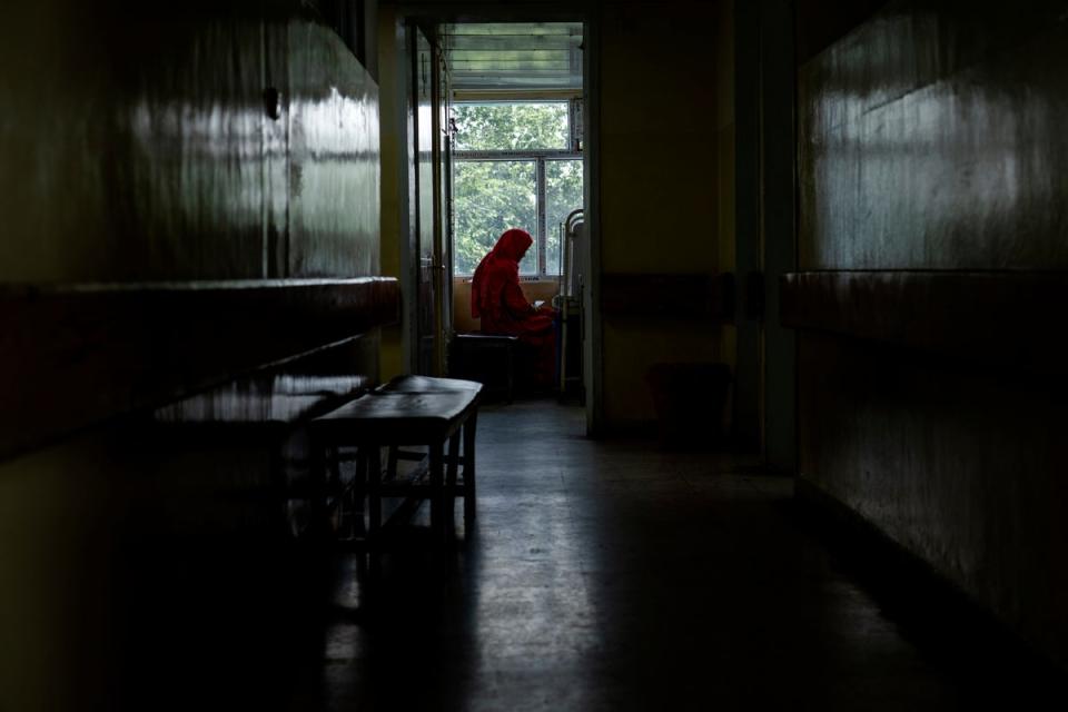 An Afghan mother sits by her child's bed at the malnutrition ward of the Indira Gandhi hospital in Kabul, Afghanistan (Copyright 2022 The Associated Press. All rights reserved.)