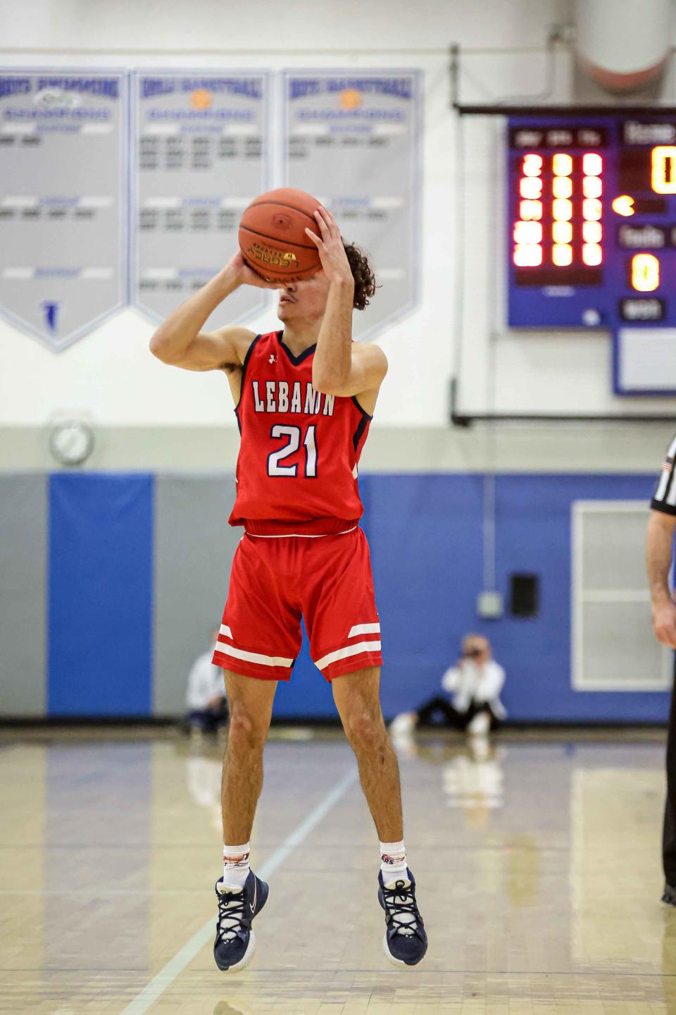 Lebanon's Adrian Cruz (21) opens the scoring by sinking a 3-pointer in a recent game at Cedar Crest.