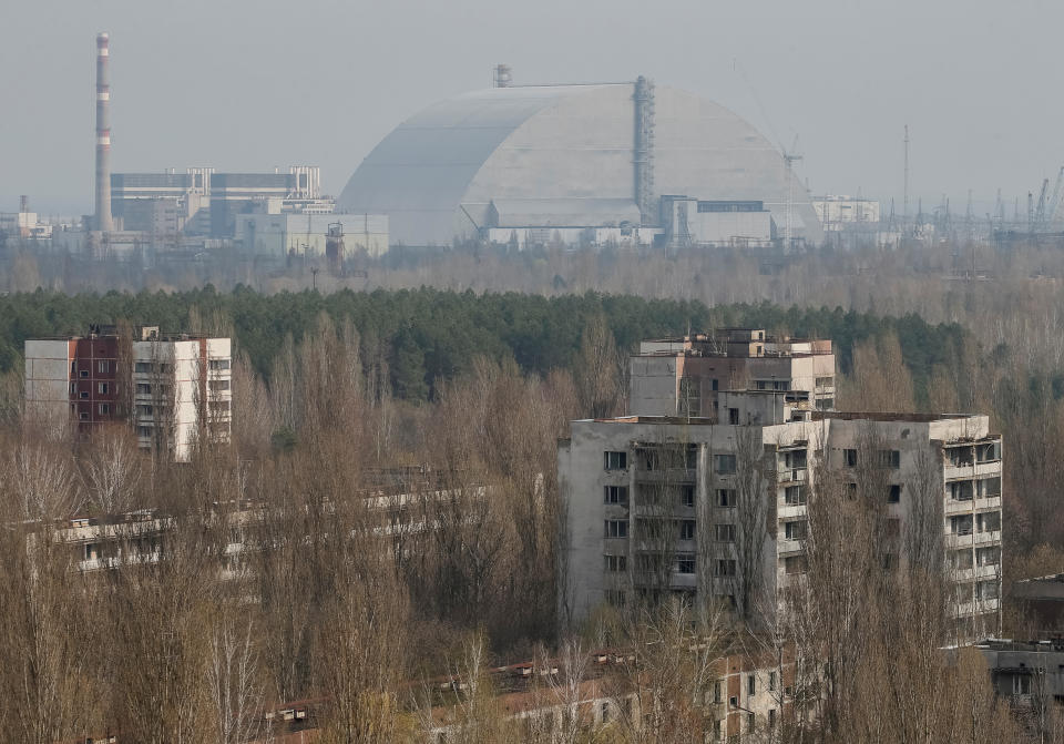 A New Safe Confinement (NSC) structure over the old sarcophagus covering the damaged fourth reactor at the Chernobyl nuclear power plant is seen from Ukraine's abandoned town of Pripyat, Ukraine, April 5, 2017.  REUTERS/Gleb Garanich