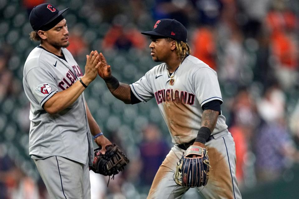 Cleveland Guardians' Jose Ramirez, right, and Josh Naylor celebrate after a baseball game against the Houston Astros Monday, May 23, 2022, in Houston. The Guardians won 6-1. (AP Photo/David J. Phillip)