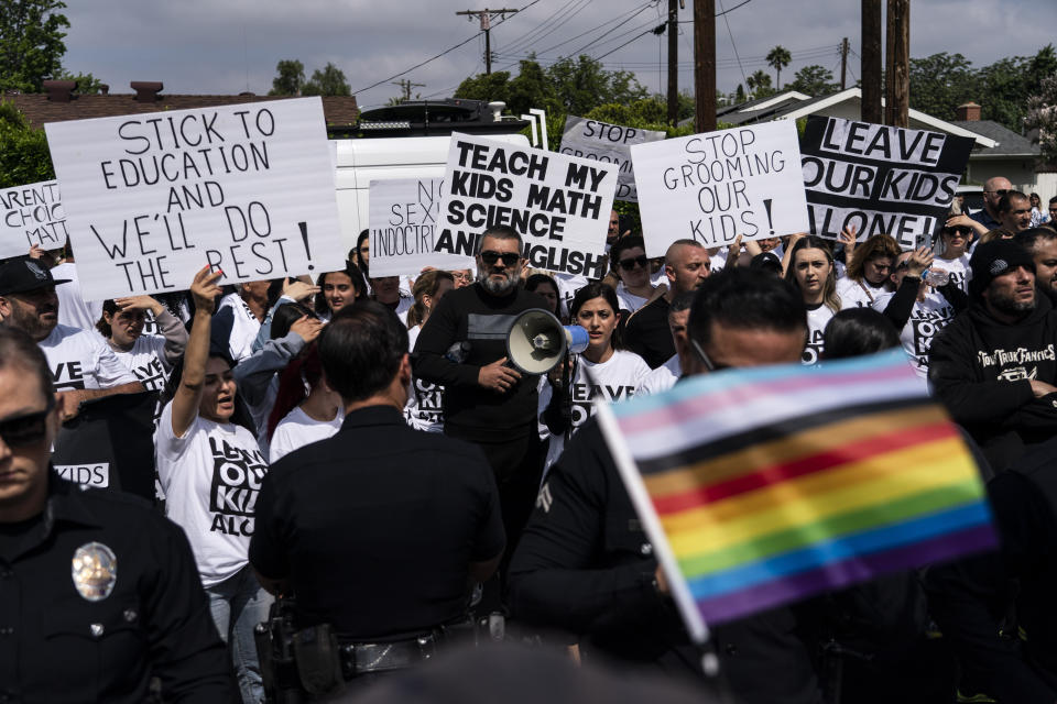 Police officers separate protestors outside the Saticoy Elementary School in Los Angeles on Friday, June 2, 2023. Police officers separated groups of protesters and counterprotesters outside the elementary school that has become a flashpoint for Pride month events across California. (AP Photo/Jae C. Hong)