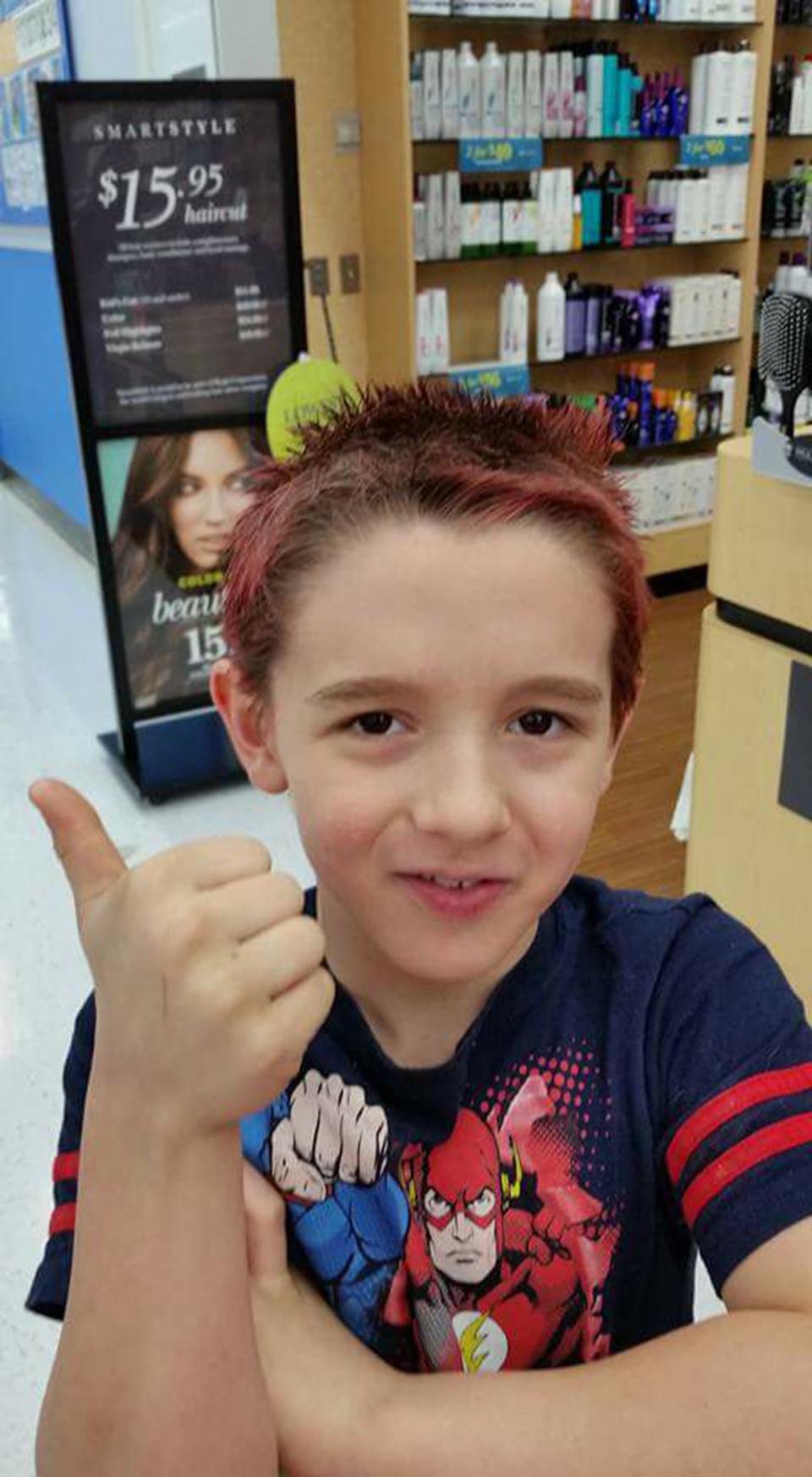 "Autism in our house is constant conversations about Minecraft and Skylanders. We are pretty proud of this photo. It was six years in the making. His last.hair cut at a salon was when he was 3 years old. He would go into meltdowns from the sensory overload of a haircut. In February 2017, he kept asking to dye his hair red, so we went back. He got a haircut and dye. He was so proud and so were we! He's 9 now, almost 10 and every day has its challenges, but every day I also see him persevere through uncomfortable sensory or social situations. He's come so far and we are beside him every step of the way!"