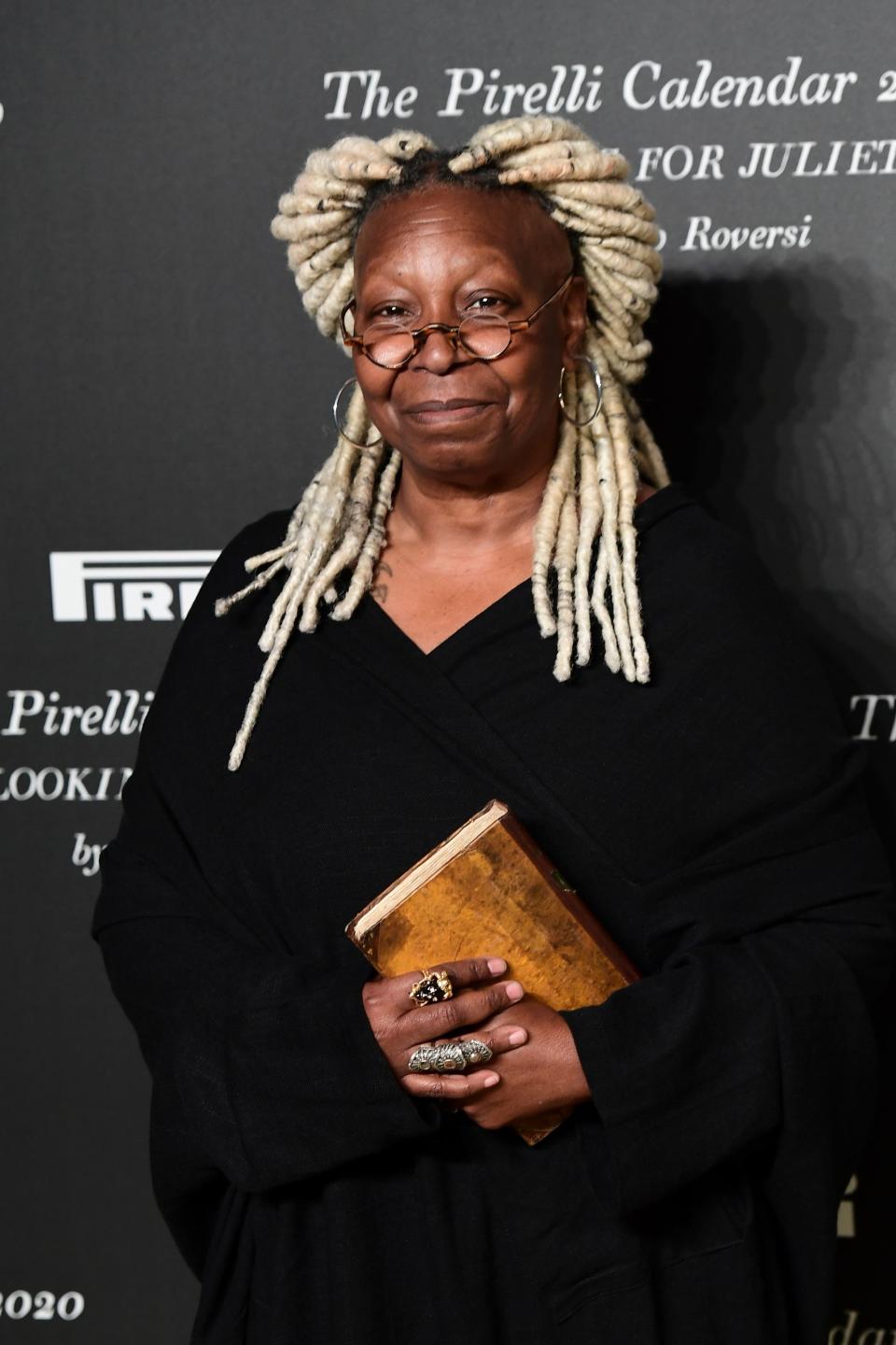 Holding a book on the red carpet