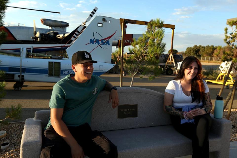 Two students sitting on a bench