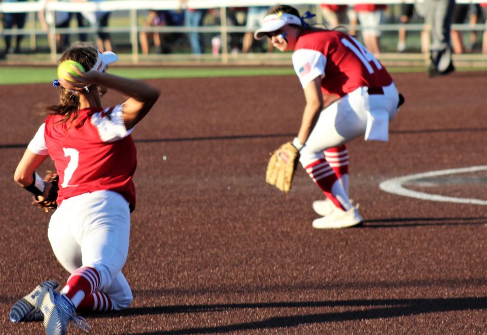 Coahoma shortstop Madison Rodgers (2) makes the stop and throws to first base over third baseman Kaedyn Lee against Holliday. Rodgers hit a solo home run in the first inning to give her team a lead it wouldn't surrender in a 5-1 win.