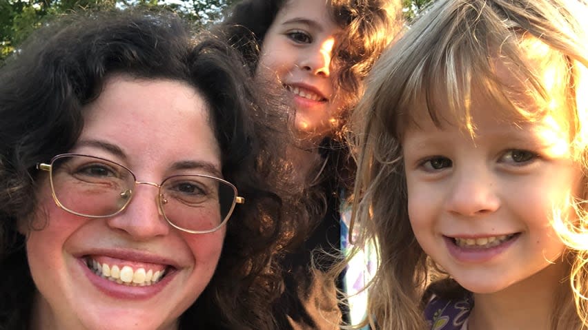 Kathleen Gadd, pictured here with her daughters Renée Martin, eight, (behind) and Cameron Martin, six, (right) on the first day of school in September, said being in a classroom all day is a lengthy exposure if someone is COVID-positive.