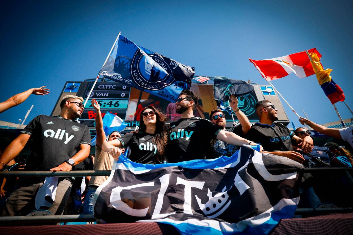 Charlotte FC fans cheer in the stands during warms up before a game between the Charlotte FC and the Vancouver Whitecaps at Bank of America Stadium in Charlotte, N.C., Sunday, May 22, 2022.