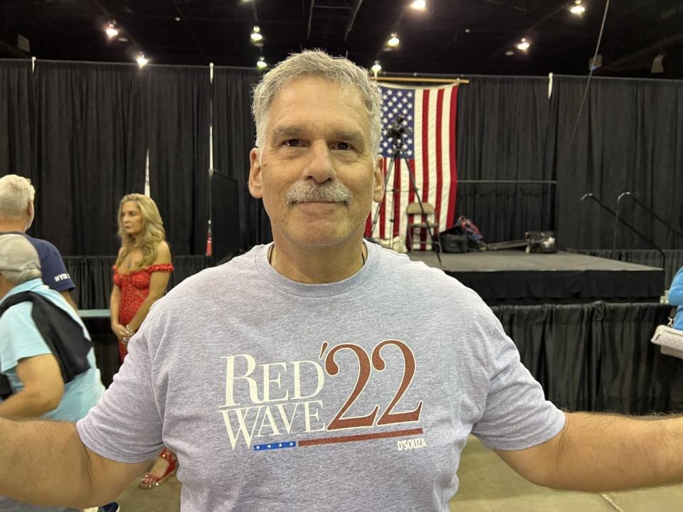 An audience member at a Nov. 1 rally in Sarasota for Republican U.S. Sen. Marco Rubio shows of his "red wave" shirt. Florida Republicans say they're feeling confidant heading into Election Day Tuesday, while many Democrats are pessimistic.