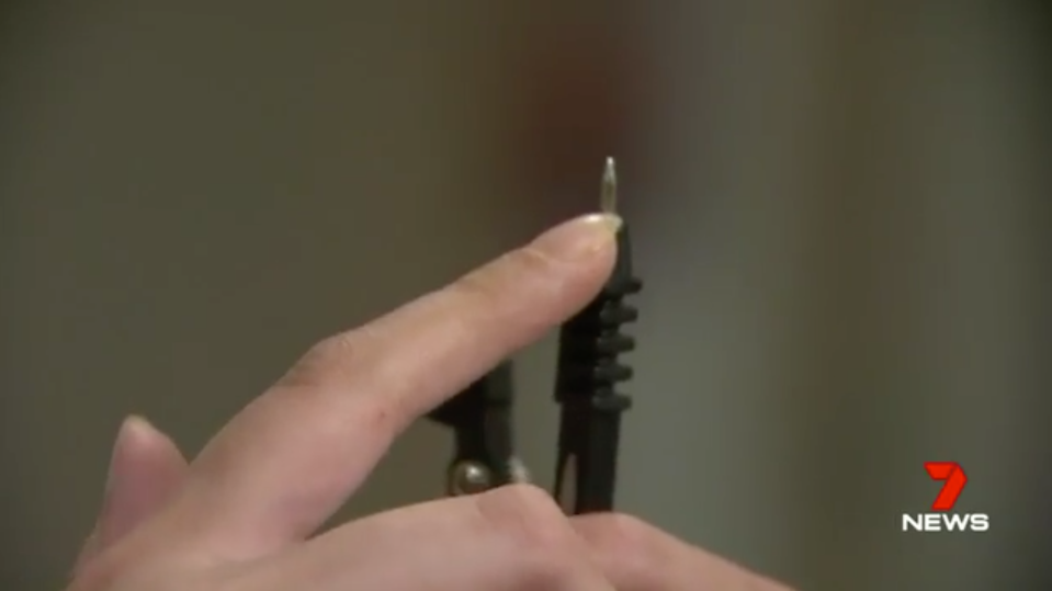 A compass needle is pictured.