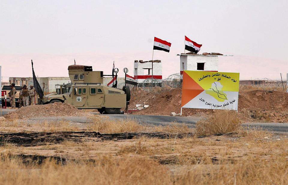 Iraqi security forces secure the Iraq-Syria border around Rabiaa border crossing, Iraq, Wednesday, Oct. 16, 2019. Najah al-Shammari, Iraq's defense minister said that some members of the Islamic State group were able to flee northern Syria and cross into Iraq. The Iraqi official added that some of them are still at large while others were detained. (AP Photo/Hadi Mizban)