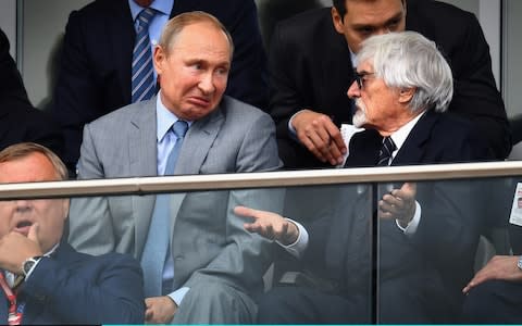 Russia President Vladimir Putin and Bernie Ecclestone, Chairman Emeritus of the Formula One Group, talk during the Formula One Grand Prix of Russia at Sochi Autodrom - Credit: Getty Images