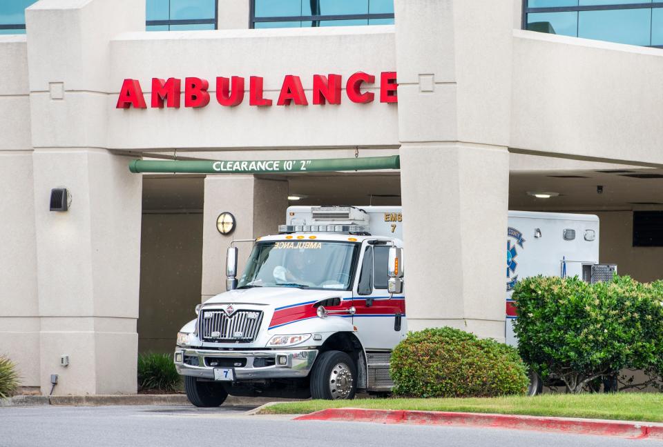 An Escambia County EMS ambulance prepares to depart Ascension Sacred Heart Hospital in Pensacola on May 11.